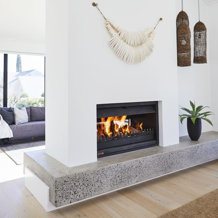 A Jetmaster Universal Double-Sided fireplace provides generous radiant and convection heat.